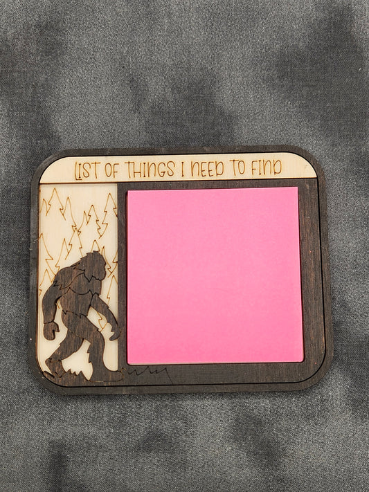Wooden sticky note holder with bigfoot and the words "List of things I need to find"