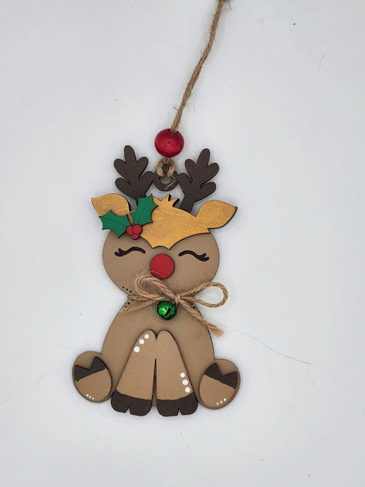 Reindeer ornament with gold detail and a bell 